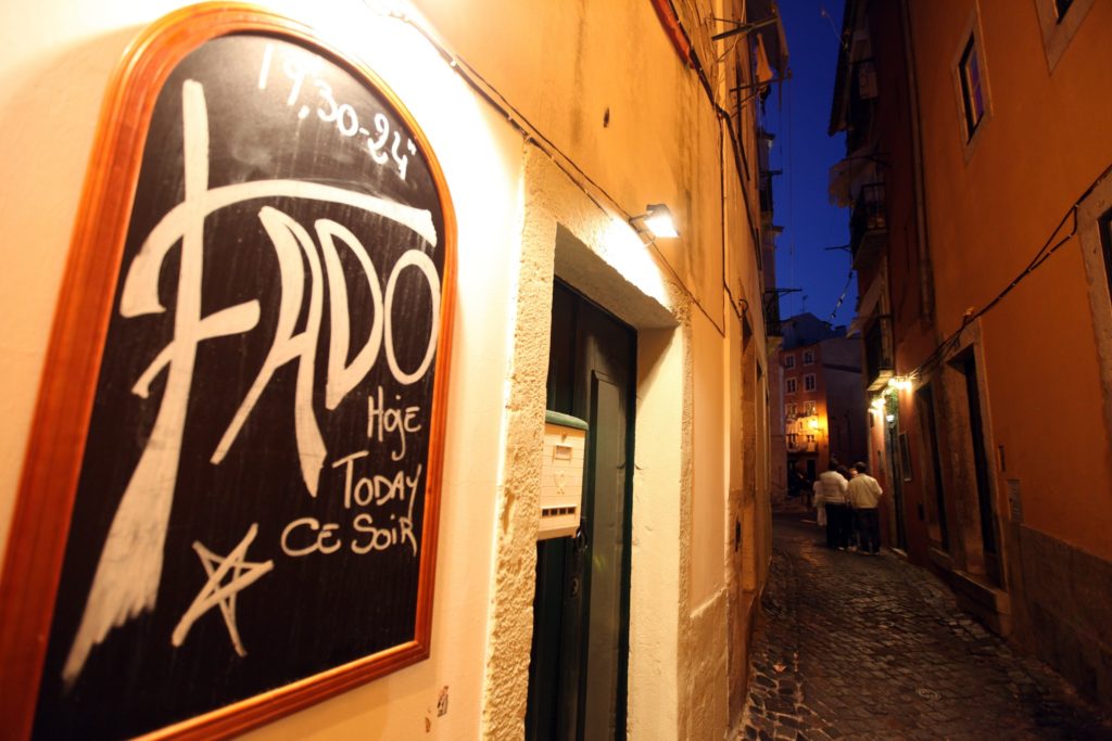 Narrow street of Lisbon with a Fado restaurant