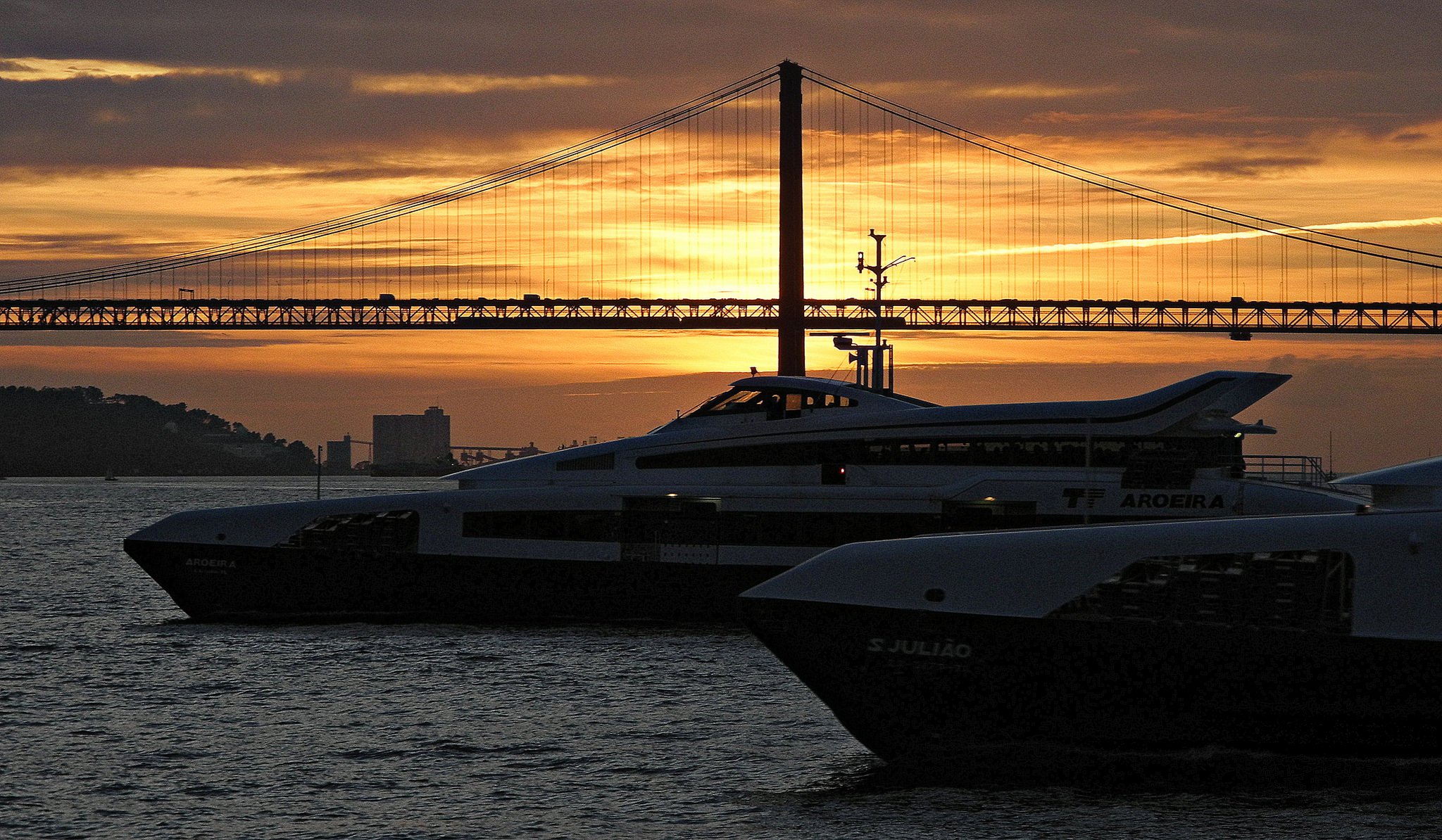 Lisbon boats and ferries at sunset