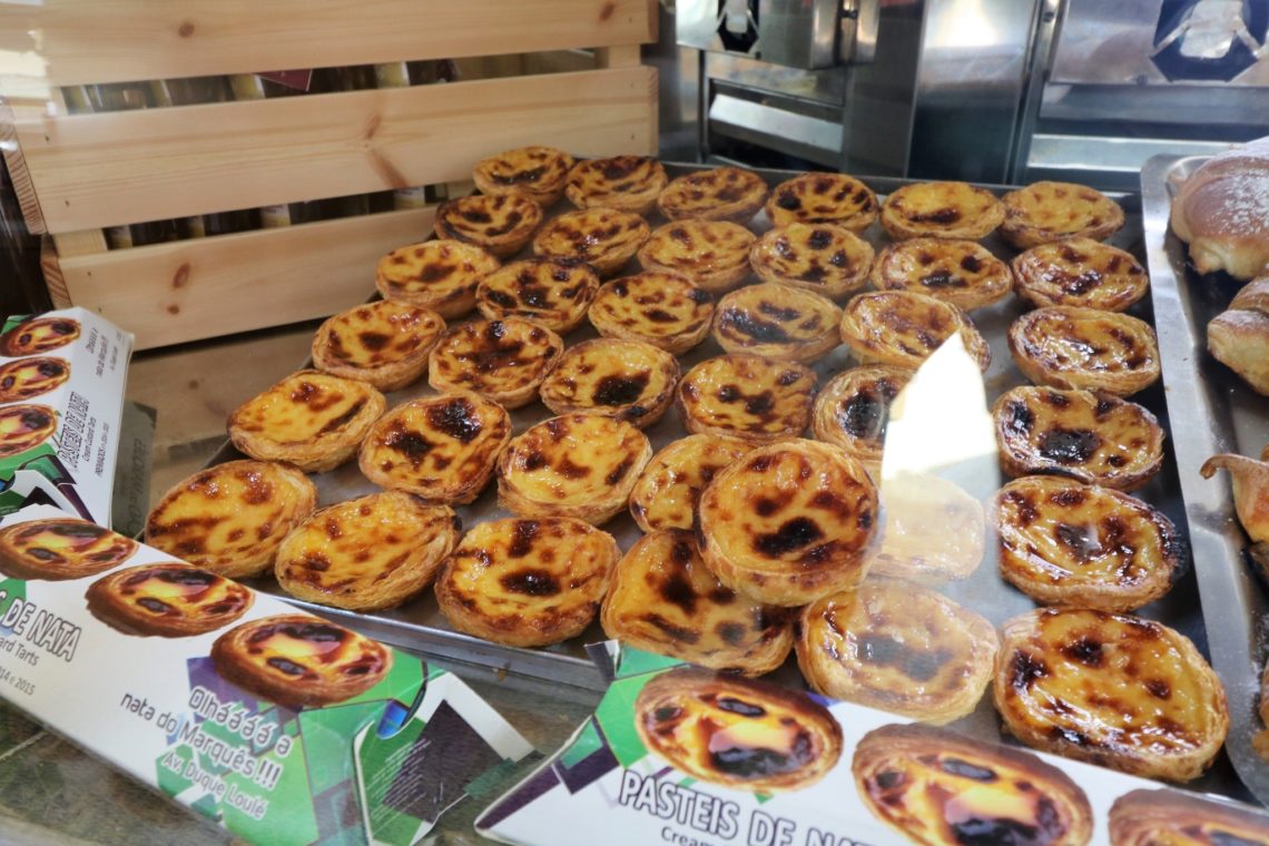 Pasteis de nata ready to be savoured and sold in the shop window of the